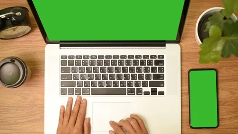 Top view of woman hand using laptop computer with a key green screen set on work Stock Footage 105093662