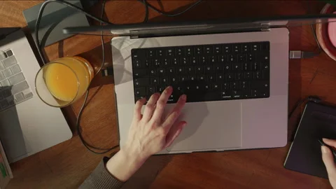Top view of woman hands using graphic pen,working by laptop,working or studying Stock Footage 235699035
