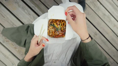 Top view on woman open box of takeaway noodles Stock Footage 156017366