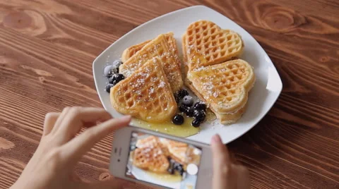 Top view woman photographing breakfast using mobile phone Belgian waffles Stock Footage