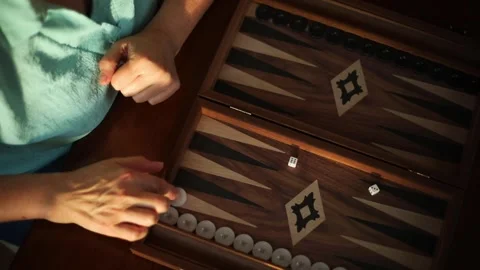 Top View of Woman Playing Backgammon at Home Stockbeeldmateriaal 332639910