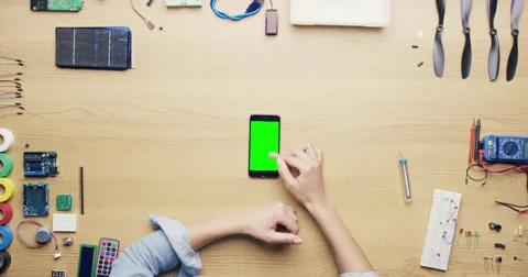Top view woman software engineer using smartphone touchscreen at desk from above Stock Footage 46805586