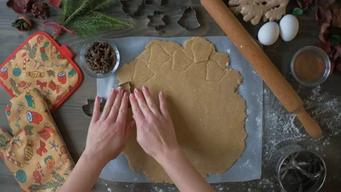 Top view of a woman's hand making a gingerbread cookie. Christmas and New Year Video stock 144469719