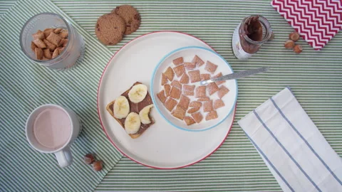 Top view woman's hand picks up Cup of cocoa while enjoying Breakfast Video stock 138079084
