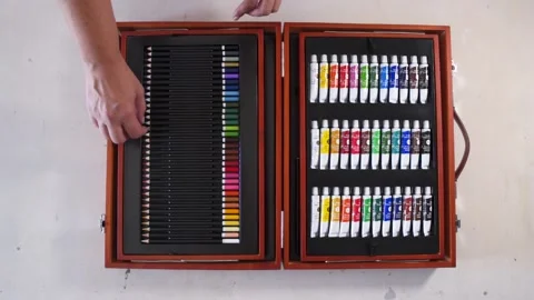 Top view of woman's hands picking art supplies from case Stock-Footage 130912227