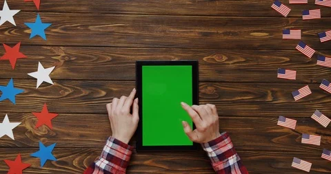 Top view on the woman's hands scrolling and taping on the black tablet device Stock Footage 91716050