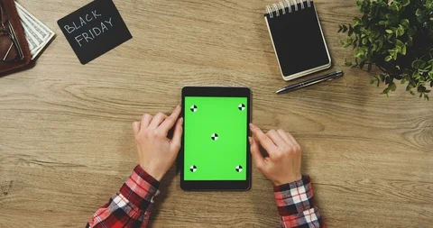 Top view on the woman's hands using the black vertical tablet device with a Video stock 89956362