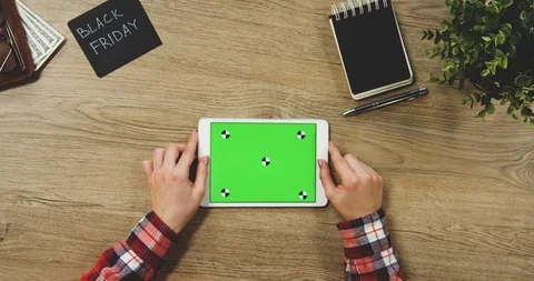 Top view on the woman's hands using the white horizontal tablet device with a Stock Footage 89957205