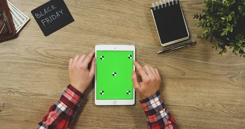 Top view on the woman's hands using the white vertical tablet device with a Stock Footage 89957372