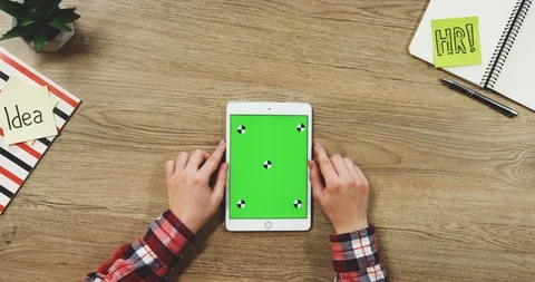 Top view on the woman's hands using the white vertical tablet device with a Stock-Footage 89960511