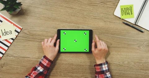 Top view on the woman's hands using the black horizontal tablet device with a Stock Footage 89960917