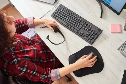 Top view of a woman's hands using the computer Stock Photos