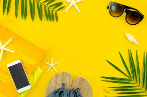Top view woman's things for beach, sunglasses, towel. phone and slippers. Flat Stock Photos