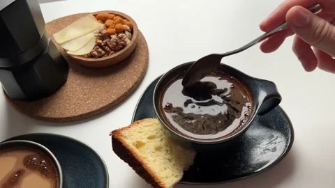 Top view women's hands taking a cup of coffee on the table Geyser coffee maker Stock Footage 238944328