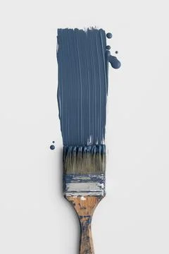Top view of a wooden paint brush with fresh navy blue color smear. Minimalist Stock Photos