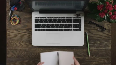 Top view of wooden table with office supplies. Stock Footage 73621023
