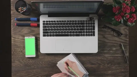 Top view of wooden table with office supplies. Stock Footage 73624261