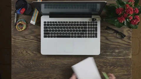 Top view of wooden table with office supplies. Stock Footage 74356366
