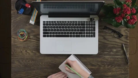Top view of wooden table with office supplies. Stock Footage 75036218