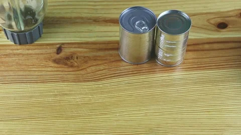 Top view on wooden table served with empty blender chalice and steel cans Stock Footage 143490821