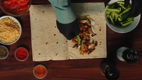 Top view of a wooden table on which shawarma is being prepared Stock Footage 318617664