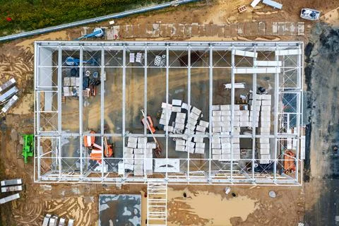 Top view of the work area and large steel frame of a large commercial buildin Stock Photos