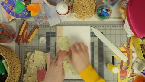 Top view of the work of craftswoman. Time lapse of scrapbooking process. Stock Footage 100305411