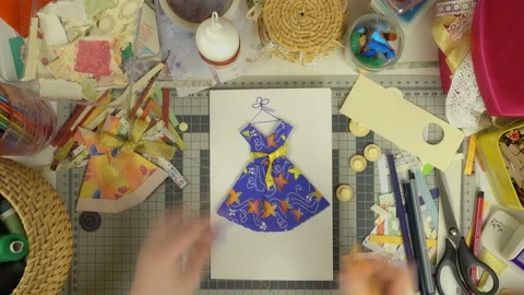 Top view of the work of craftswoman. Time lapse of scrapbooking process. Stock Footage 100305609