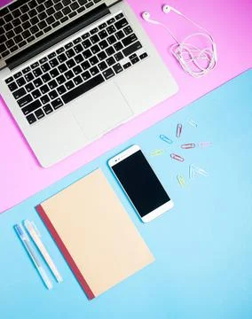 Top view of work desk.Laptop with notebook ,coffee,smartphone background Stock Photos