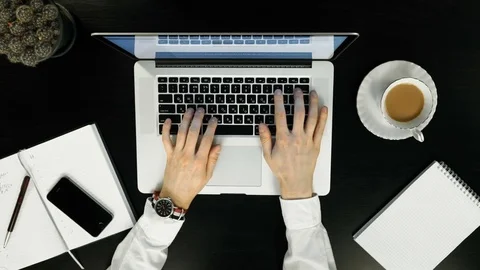 Top view - work on the laptop over,gun in hand. Stock Footage 74212627