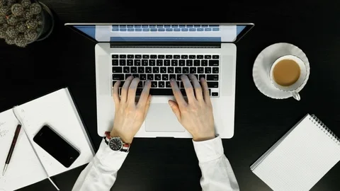 Top view - work on the laptop over,gun in hand. Stock Footage 74212971
