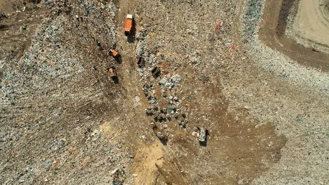 Top view of the work of refuse collection equipment disposes of waste. The 動画素材 114494042