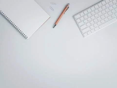 Top view of work space with brown pen and keyboard. Stock Photos