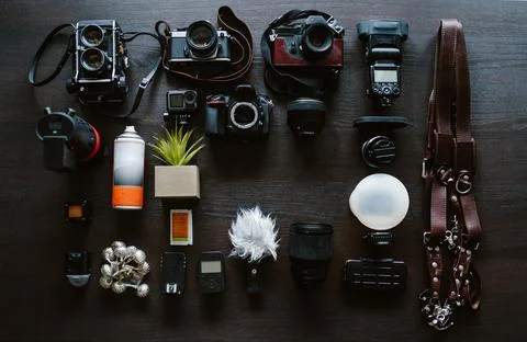Top view of work space wedding photographer. Set of digital and analog camera Stock Photos