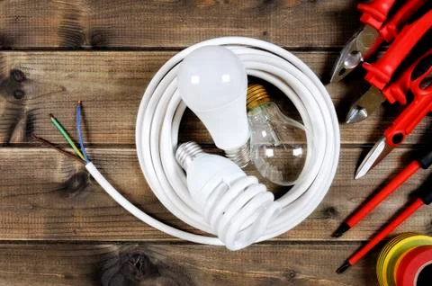 Top view of work tools and electrical system components on antique wooden bac Foto stock