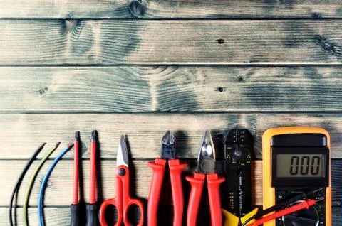 Top view of work tools for electrical installation on rustic wooden backgroun Stock Photos