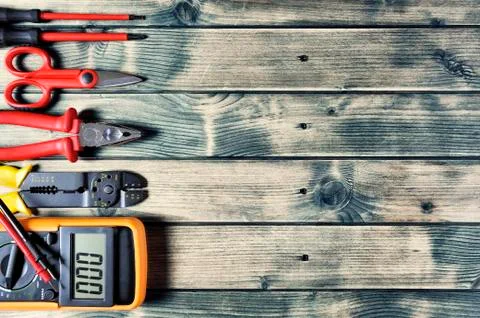 Top view of work tools for electrical installation on rustic wooden backgroun Stock Photos