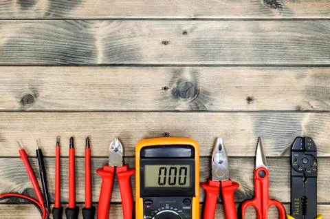 Top view of work tools for residential electrical installation on antique woo Stock Photos
