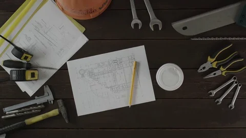 Top view of a worker checking the schematics Stock Footage 80034885