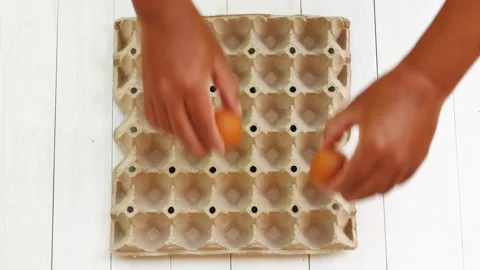 Top view worker packing eggs in a production Stock Footage 169684189