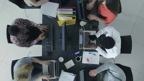 Top view of workers at the desk in the office Vídeo Stock 73846118