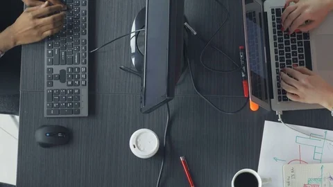Top view of workers typing on the keyboards in the office Stock Footage 73847369