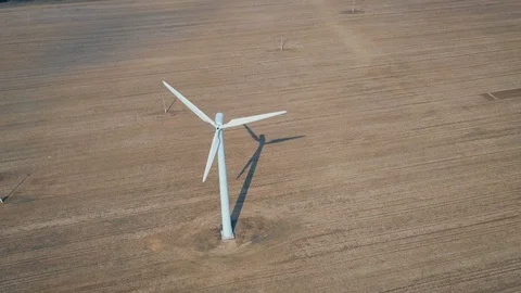 Top View Of A Working Rotating Windmill Turbine And Its Shadow In The Field Stock Footage 106623704