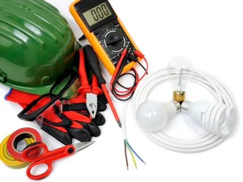 Top view of working tools and components of the electrical system on white ba Stock Photos