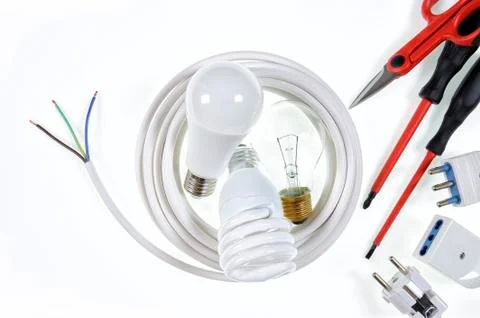 Top view of working tools and components of the electrical system on white ba Stock Photos