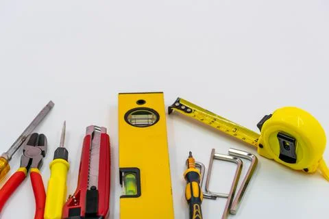 Top view of Working tools of a handy man on white background.flat lay design. Stock Photos