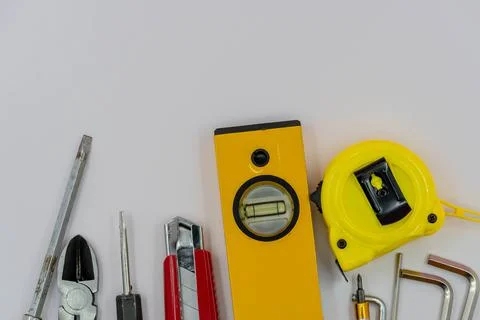 Top view of Working tools of a handy man on white background.flat lay design. Stock Photos