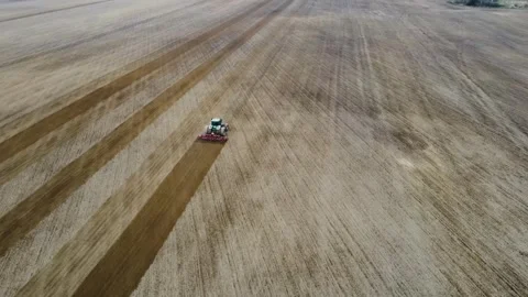Top view of working tractor in field. Technological process of preparing Stock Footage 291297005