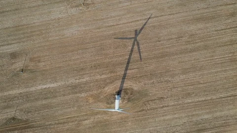 Top View Of A Working Wind Turbine And Its Shadow In The Field Stock Footage 106520682
