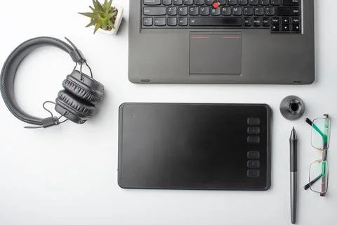 Top view of the workplace designer. Creative designer, graphics tablet, lapto Stock Photos